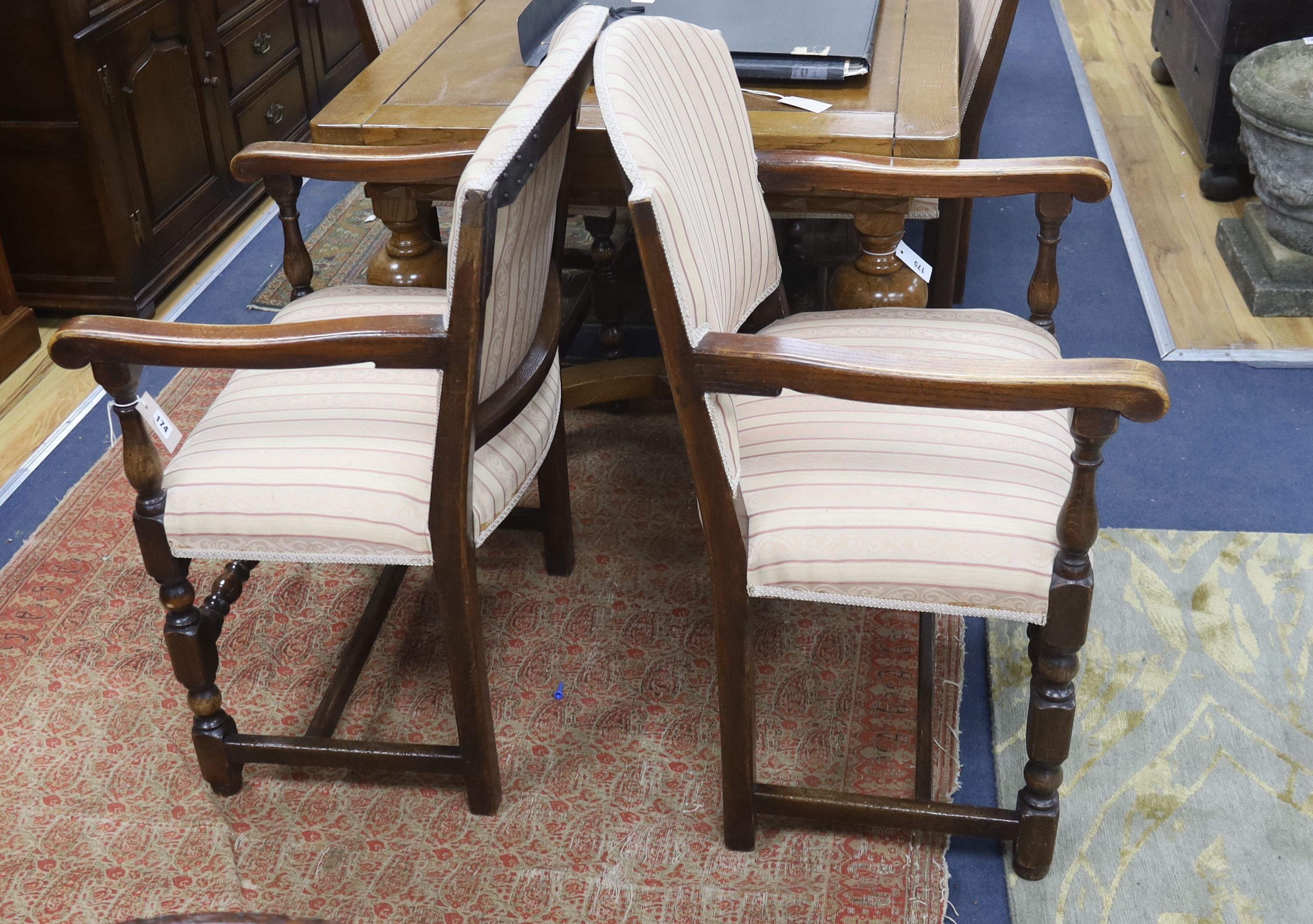 A set of eight 18th century style upholstered oak dining chairs, two with arms